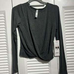NWT Alo stretchy long sleeve with twist waist. Slightly cropped.